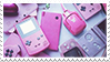 A stamp featuring various handheld gaming consoles such as the Game Boy and Nintendo DSi. Most of them are pink.